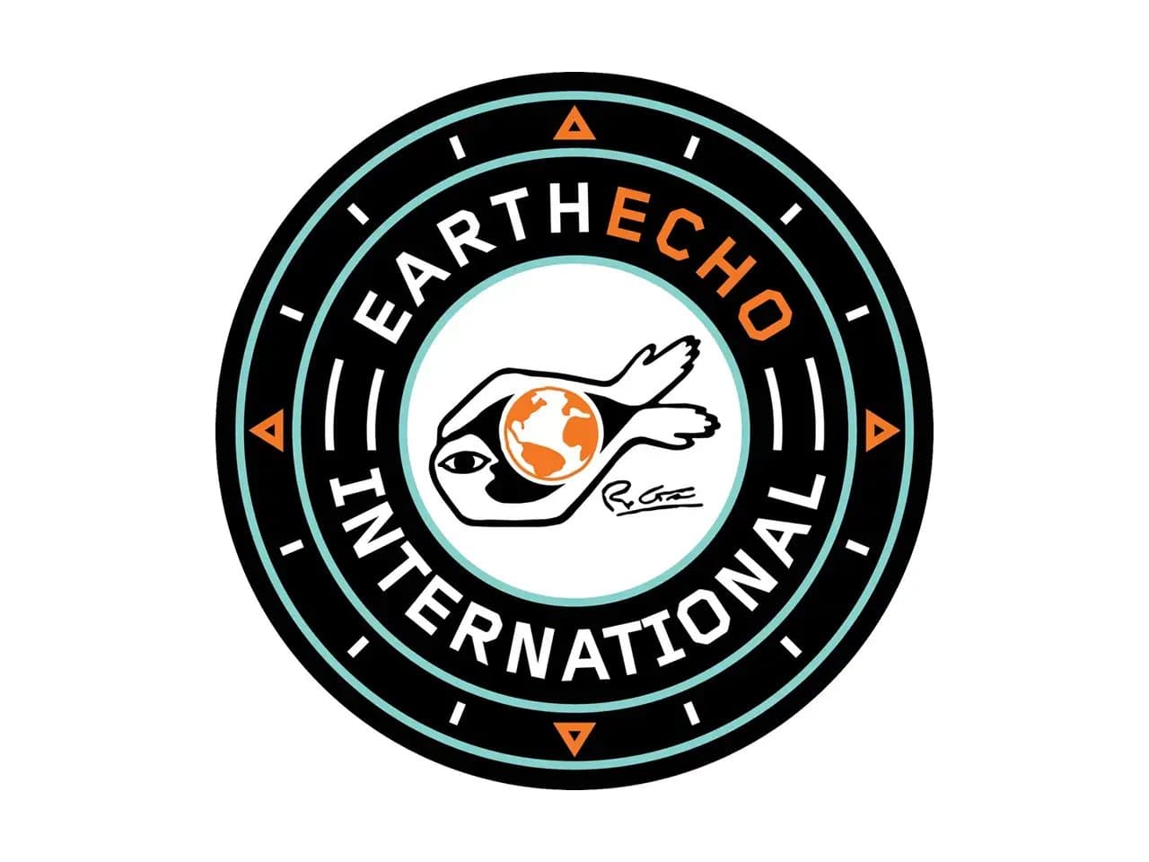 A circular logo with "EARTH ECHO INTERNATIONAL" text surrounds an eye symbol with a globe inside. The dark outer band features orange triangle accents.