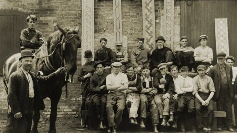 Vintage photo of group of men and boys posing with a horse